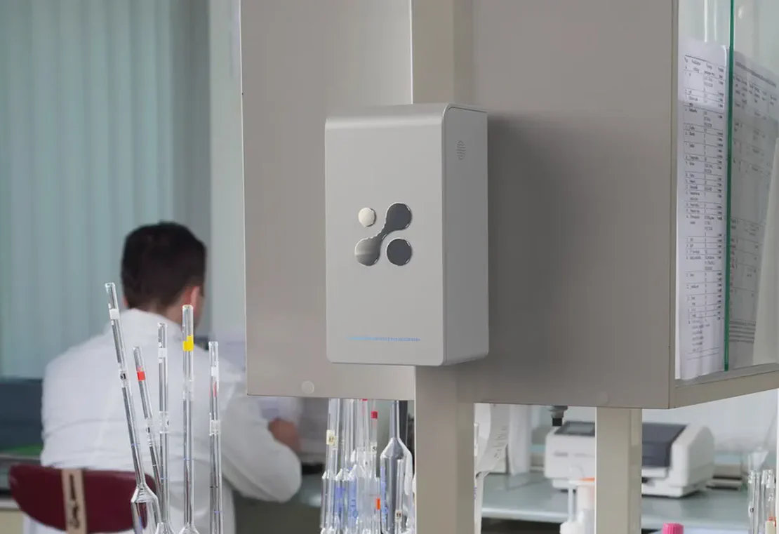 Aethair PRO deployed in a medical lab with a researcher working in the background.