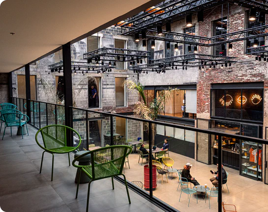 Billy Penn Studios atrium viewed from the second-floor balcony.