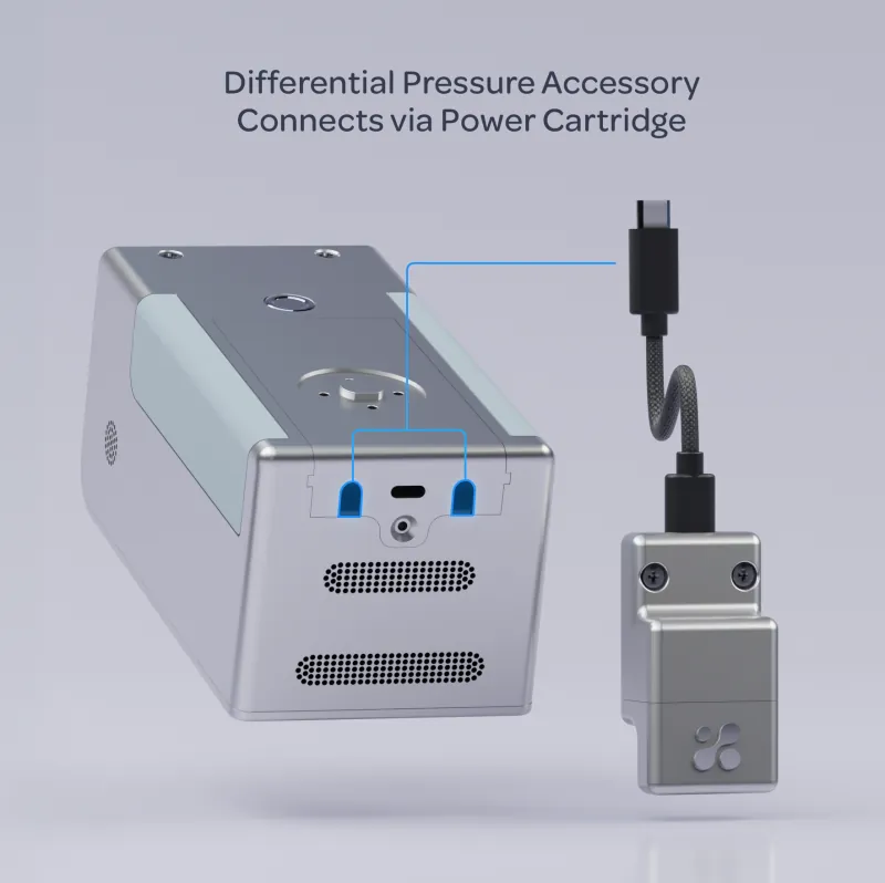 The underside of Aethair PRO with the expansion socket highlighted, beside the power cartridge and the cable for the differential-pressure accessory.