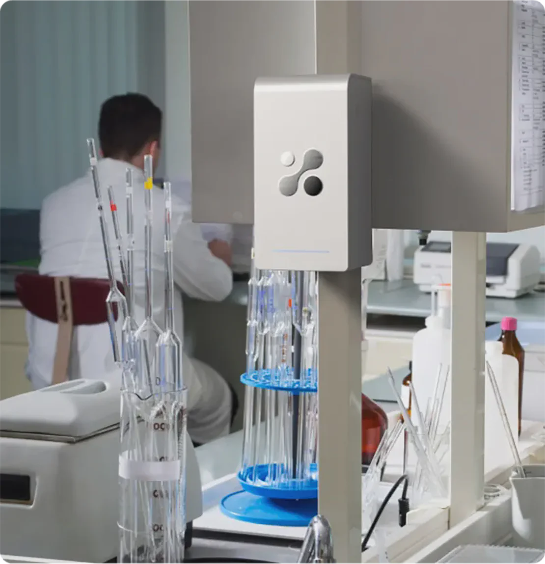 Aethair PRO mounted in a medical laboratory with a doctor working in the background.