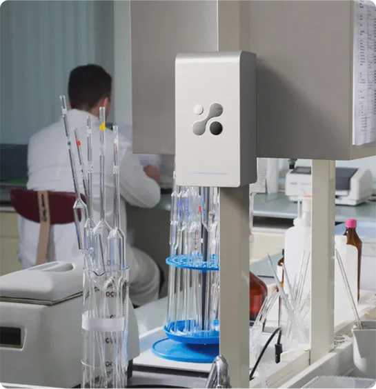 Aethair PRO mounted in a medical laboratory with a doctor working in the background.