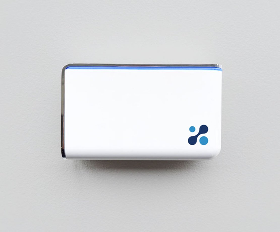Aethair IAQ mounted to a white wall.