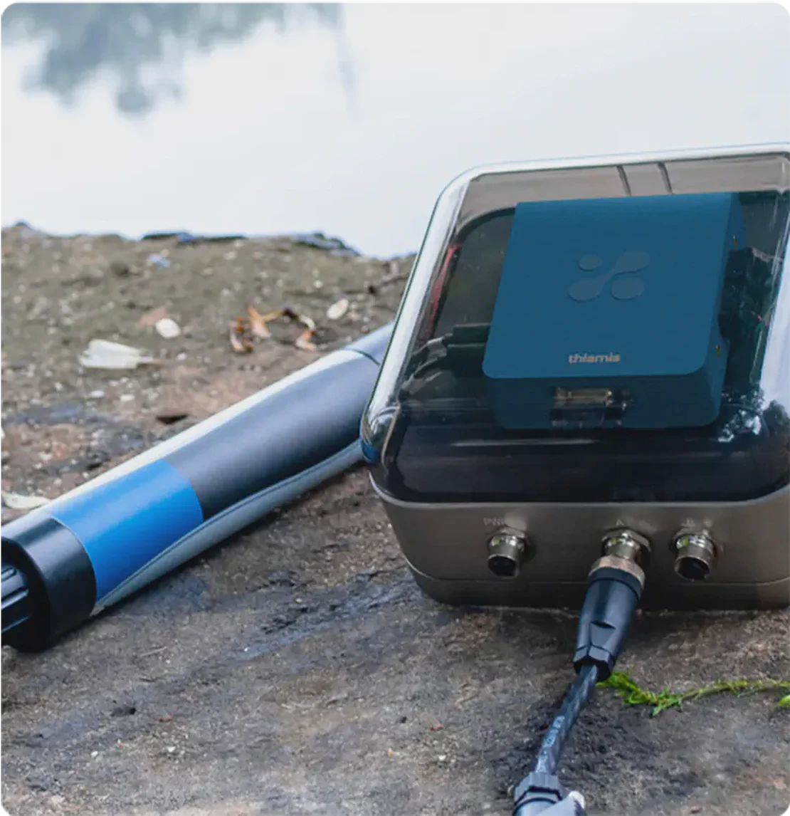 Aethair Thiamis housed inside an Aethair Node and connected to a Eureka water probe beside a body of water.