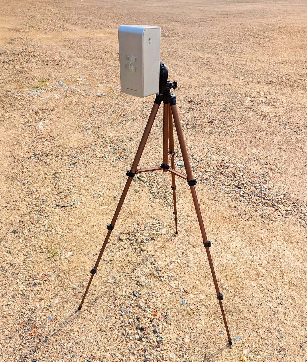 Aethair PRO mounted on a tripod at a construction site