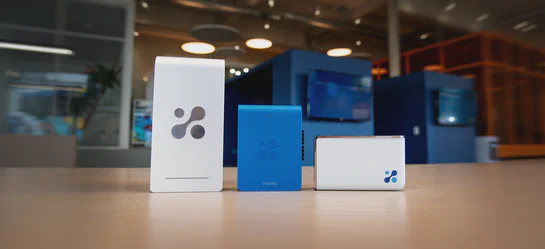 Aethair PRO, Aethair IAQ, and Thiamis devices arranged side by side, illustrating the three environmental monitoring devices in the Aethair lineup