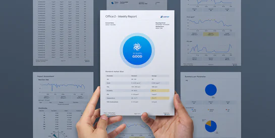EHS compliance officer reviewing environmental documentation and audit-ready reports on Environet