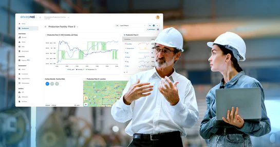 Production facility managers reviewing environmental data on Environet