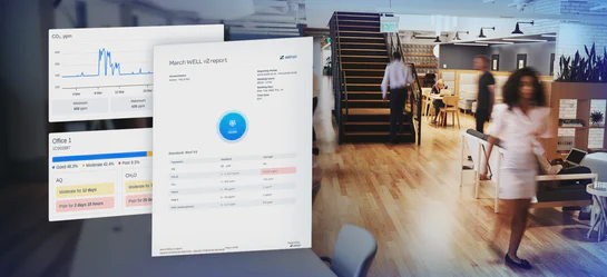 Modern office interior with visible indoor air quality monitoring supporting WELL Building Standard air quality requirements