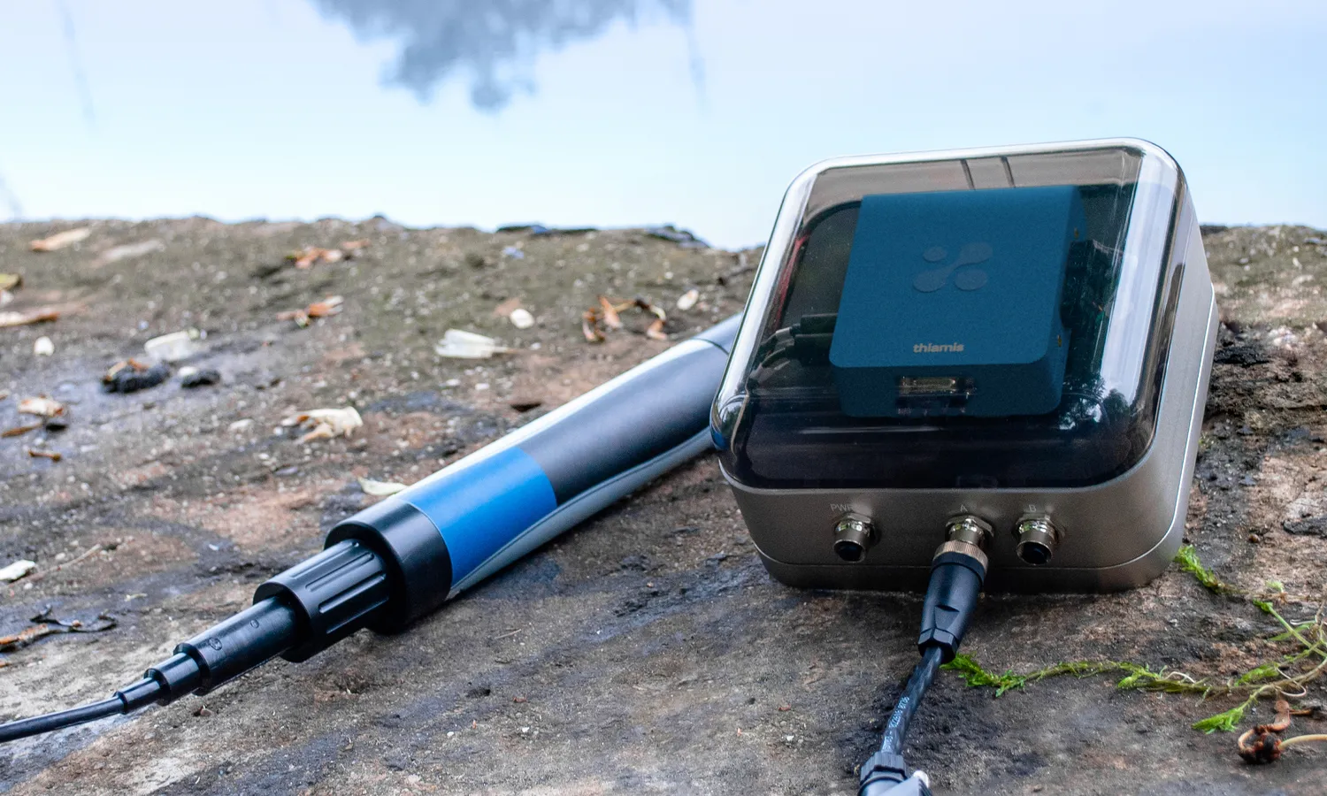 Thiamis in its field case with a probe connected, set on open ground.