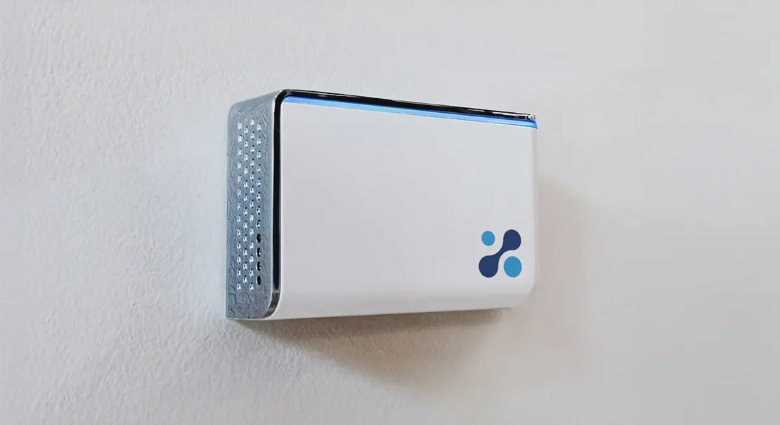 Aethair IAQ mounted to a white wall.
