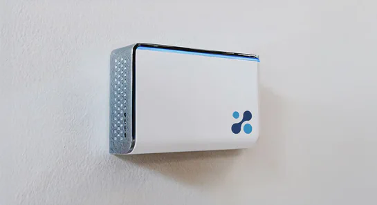 Aethair IAQ mounted to a white wall.