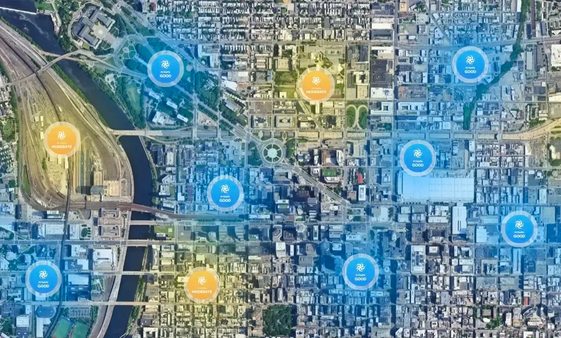 Satellite view of a city with air quality markers spread across its neighborhoods.